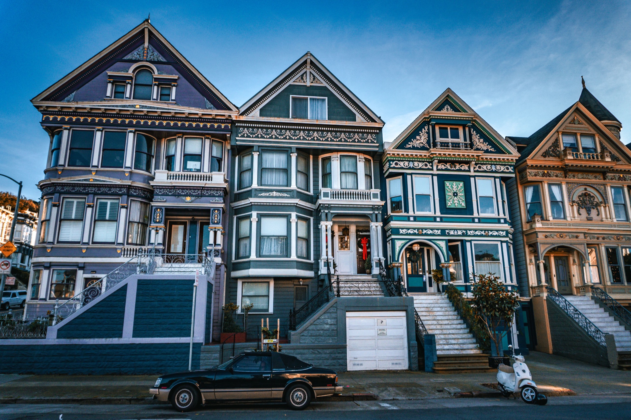 A row of well-kept homes at dusk